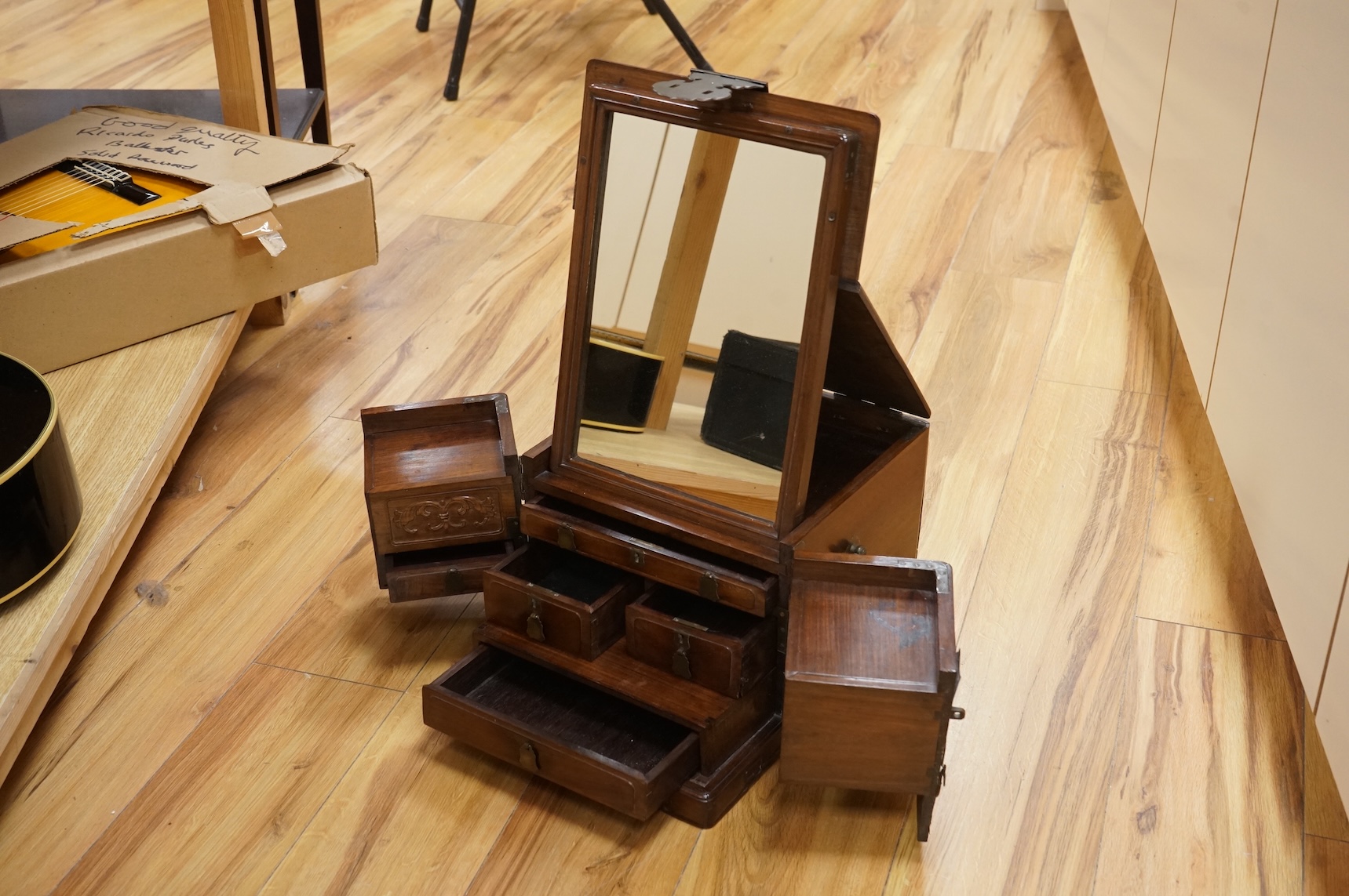A Chinese rosewood brass bound dressing chest, closed 39cm deep, 29cm wide, 23cm high.